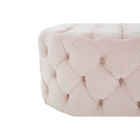 Cream velvet ottoman with deep button tufting, close-up of upholstered corner detail
