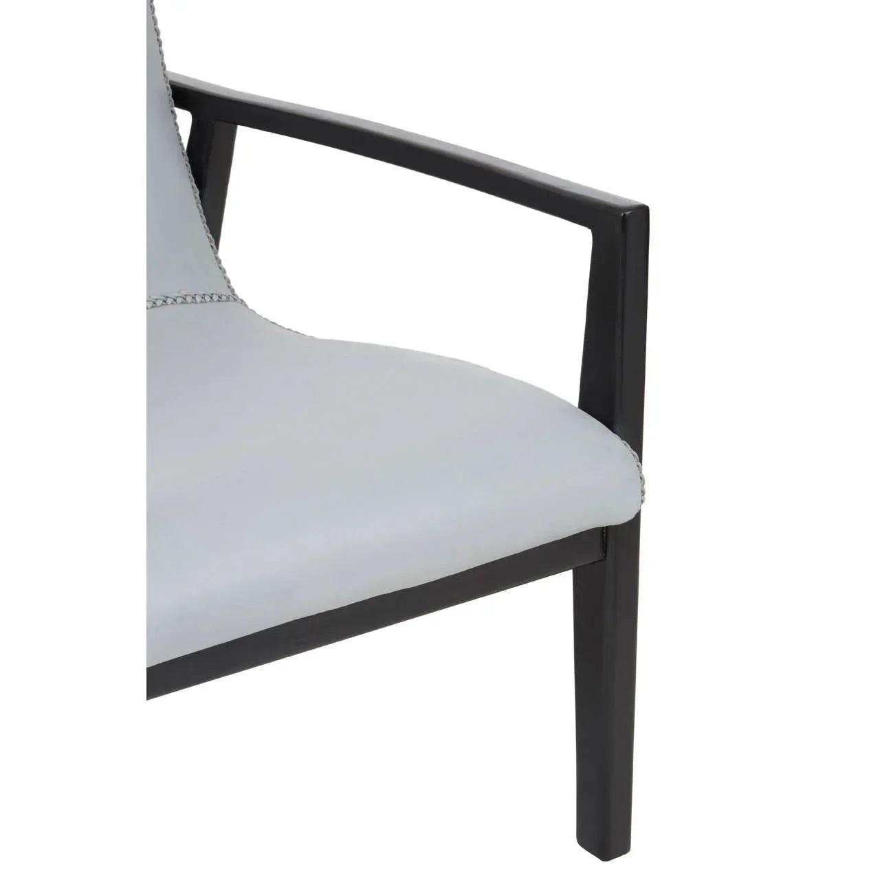 Close-up of dining chair with light grey seat and black metal armrest