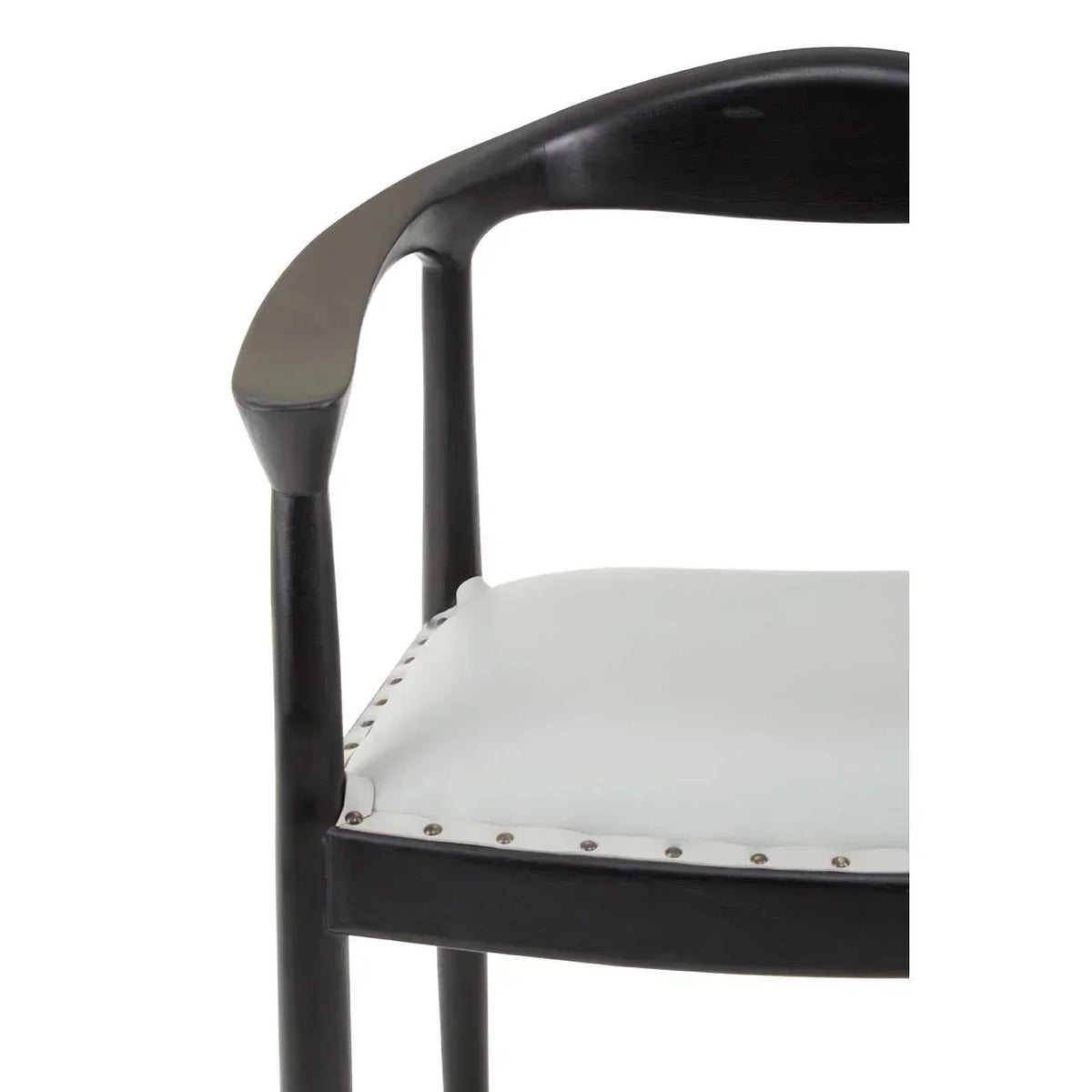 Black dining chair with curved wooden armrest and white upholstered seat close-up