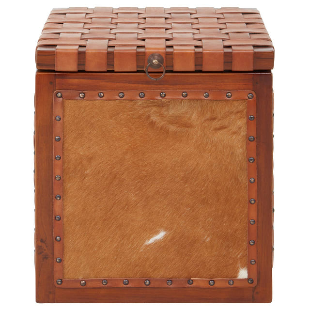 Kendari Hair on Leather Storage Stool featuring a square design with a textured, patterned top and a smooth, tan leather front panel. The stool has a warm brown color with subtle variations and a decorative border