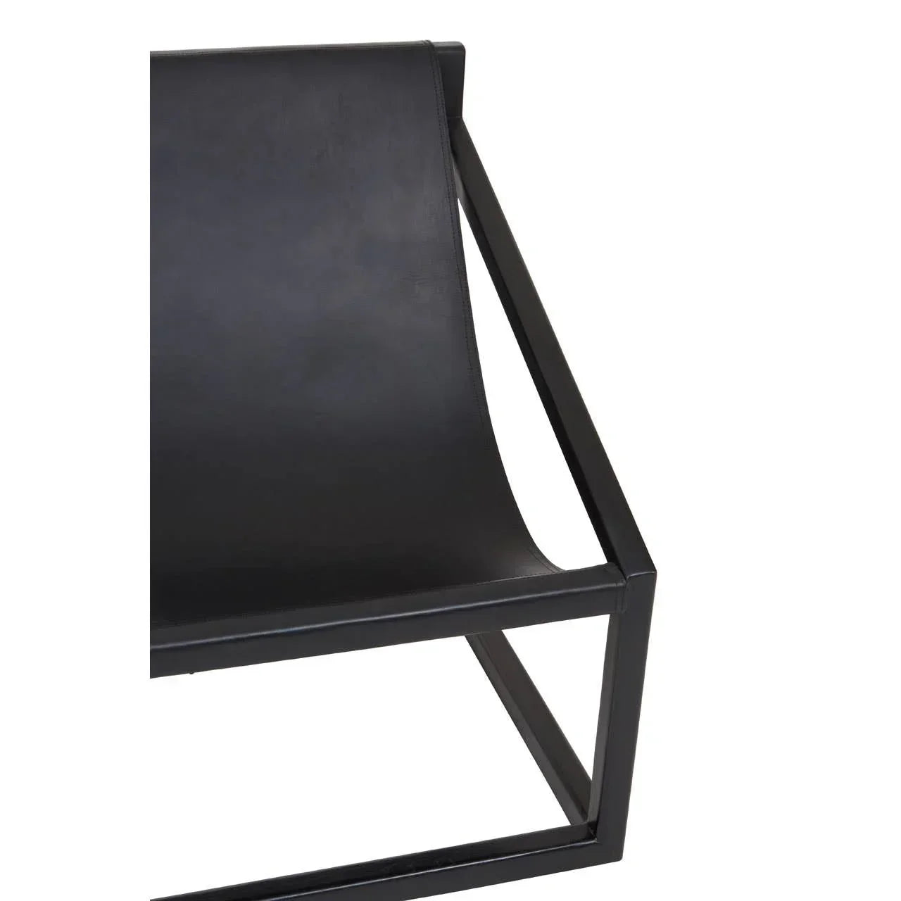 Close up of black leather lounge chair with metal frame and angular armrest