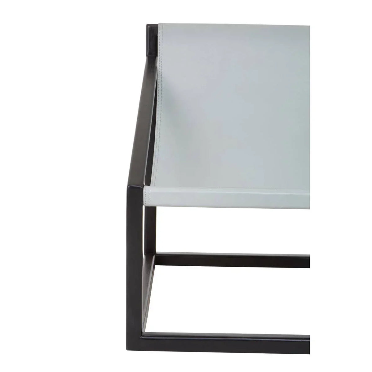 Modern accent chair with black metal frame and light grey leather sling seat, side view