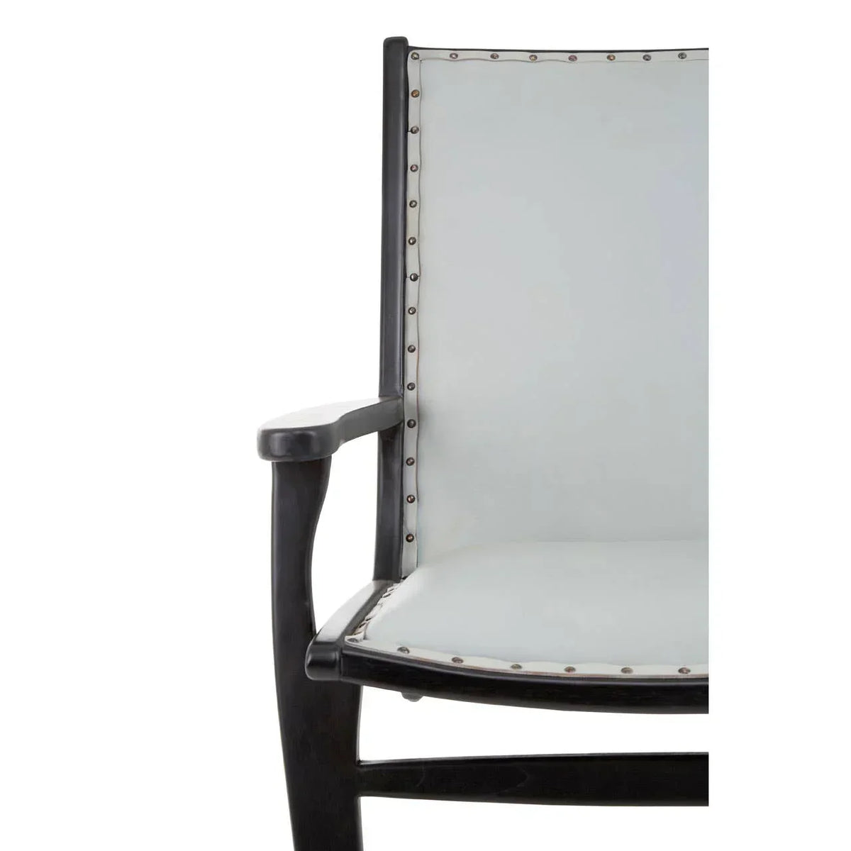 Close-up of modern armchair with black wooden frame and light upholstery with stud detailing