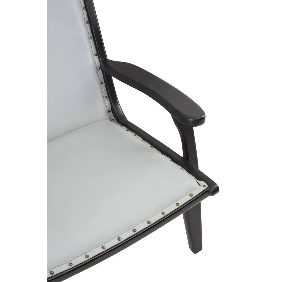 Closeup of black wooden armchair with light upholstered seat and studded trim