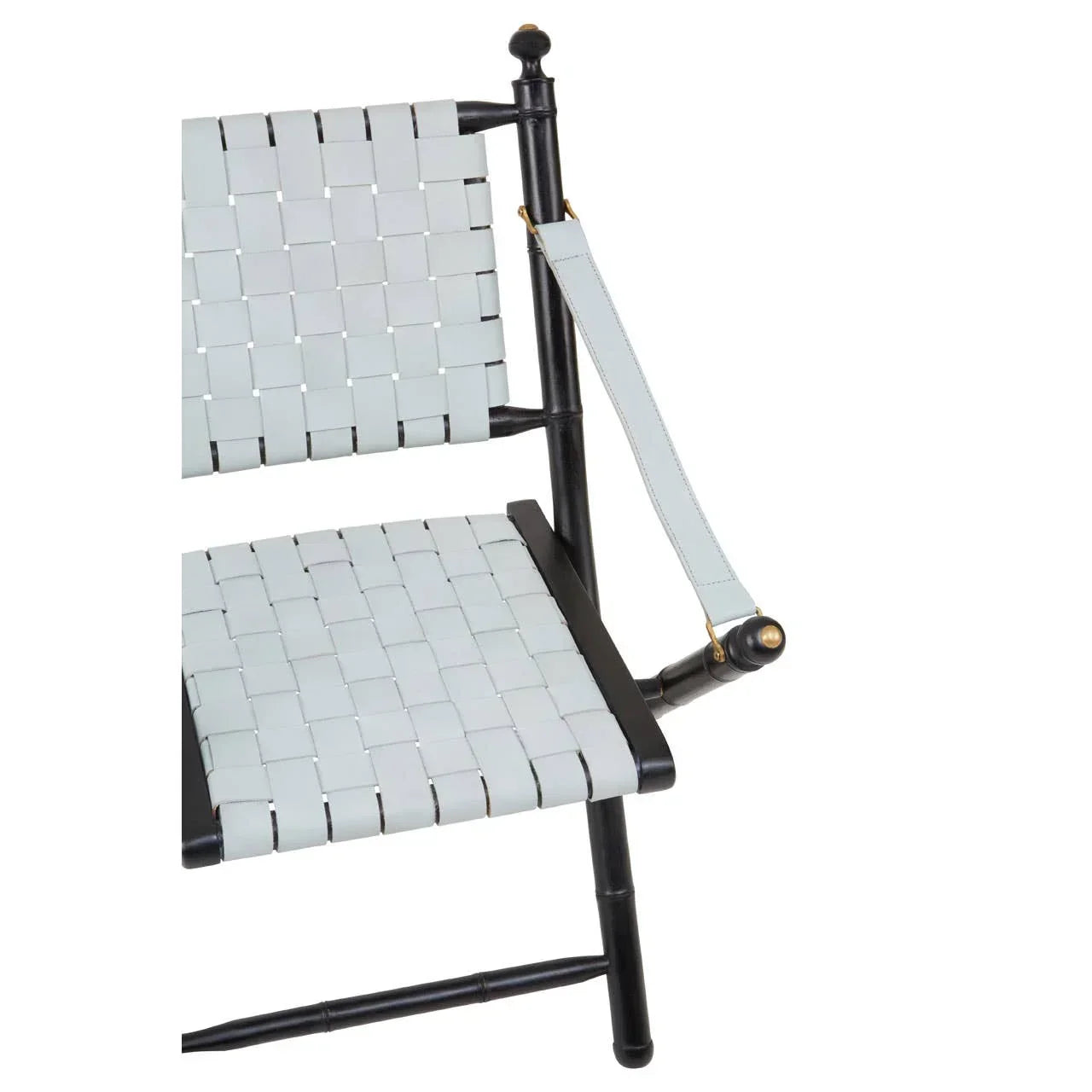 Close-up of woven leather dining chair seat and armrest with black wooden frame