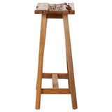 Kendari Teak Wood Stool featuring a natural wood finish, a rectangular seat with a textured surface, and four sturdy legs that provide stability. The design highlights the grain of the teak wood, showcasing its warm tones and organic appeal