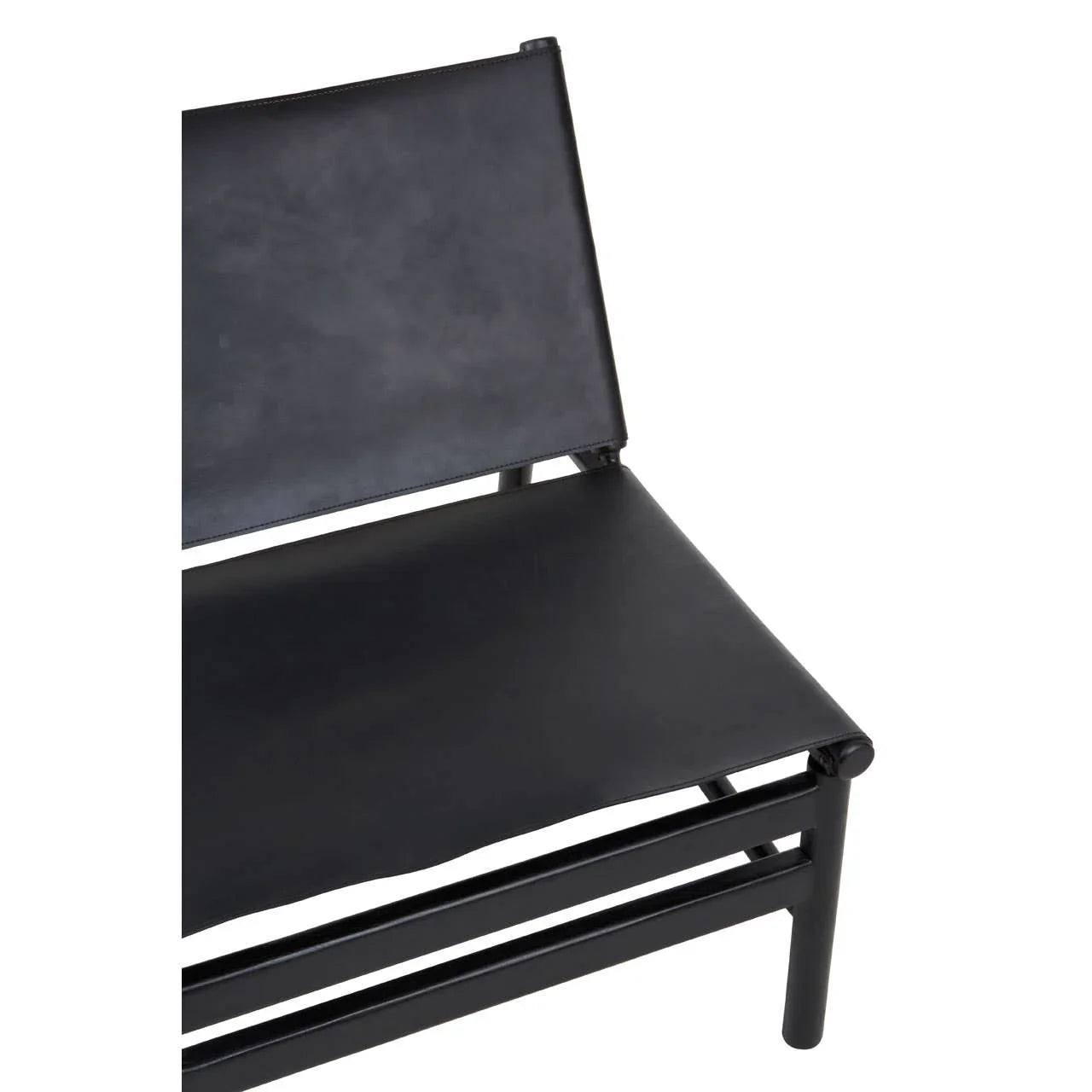 Close up of black leather accent chair with metal frame, showing seat and backrest detail