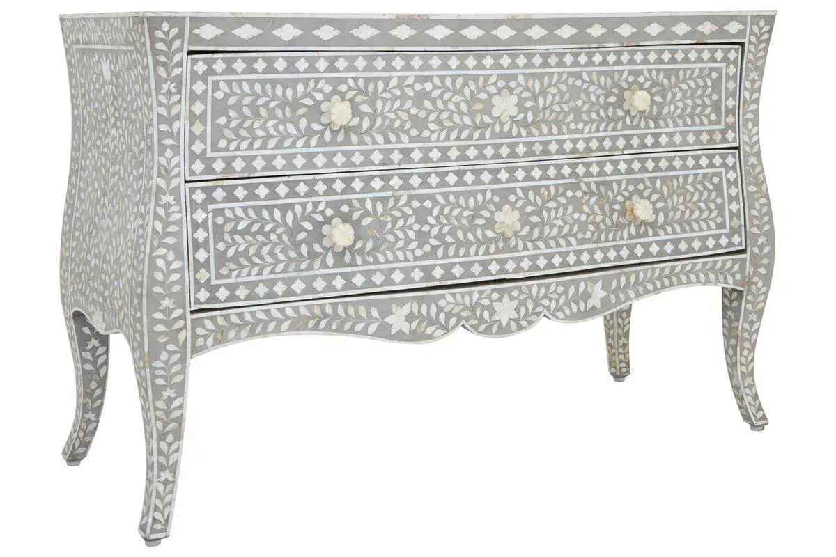 Grey chest of drawers with floral bone inlay pattern and curved legs, front view
