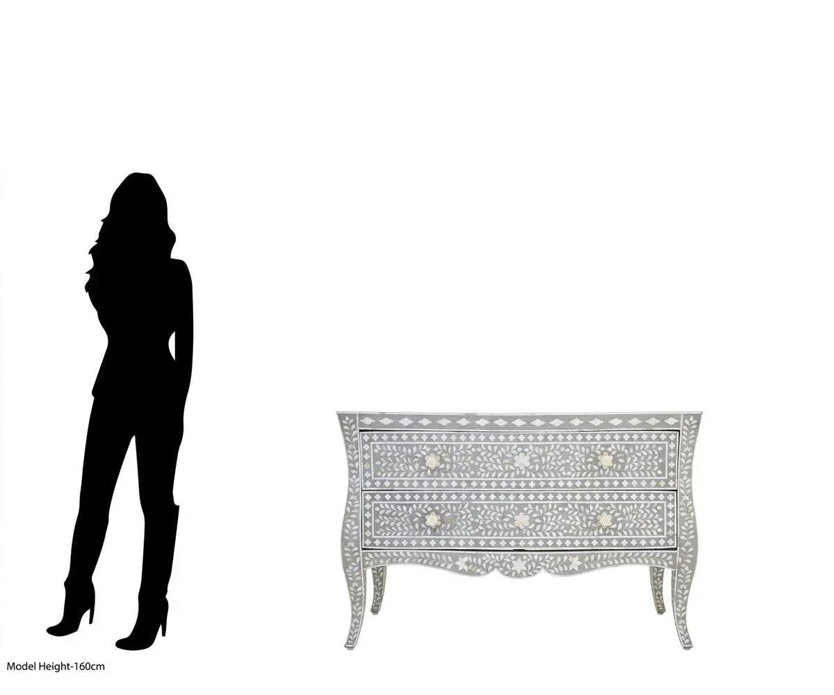 Grey bone inlay chest of drawers with floral pattern and curved legs shown beside height silhouette