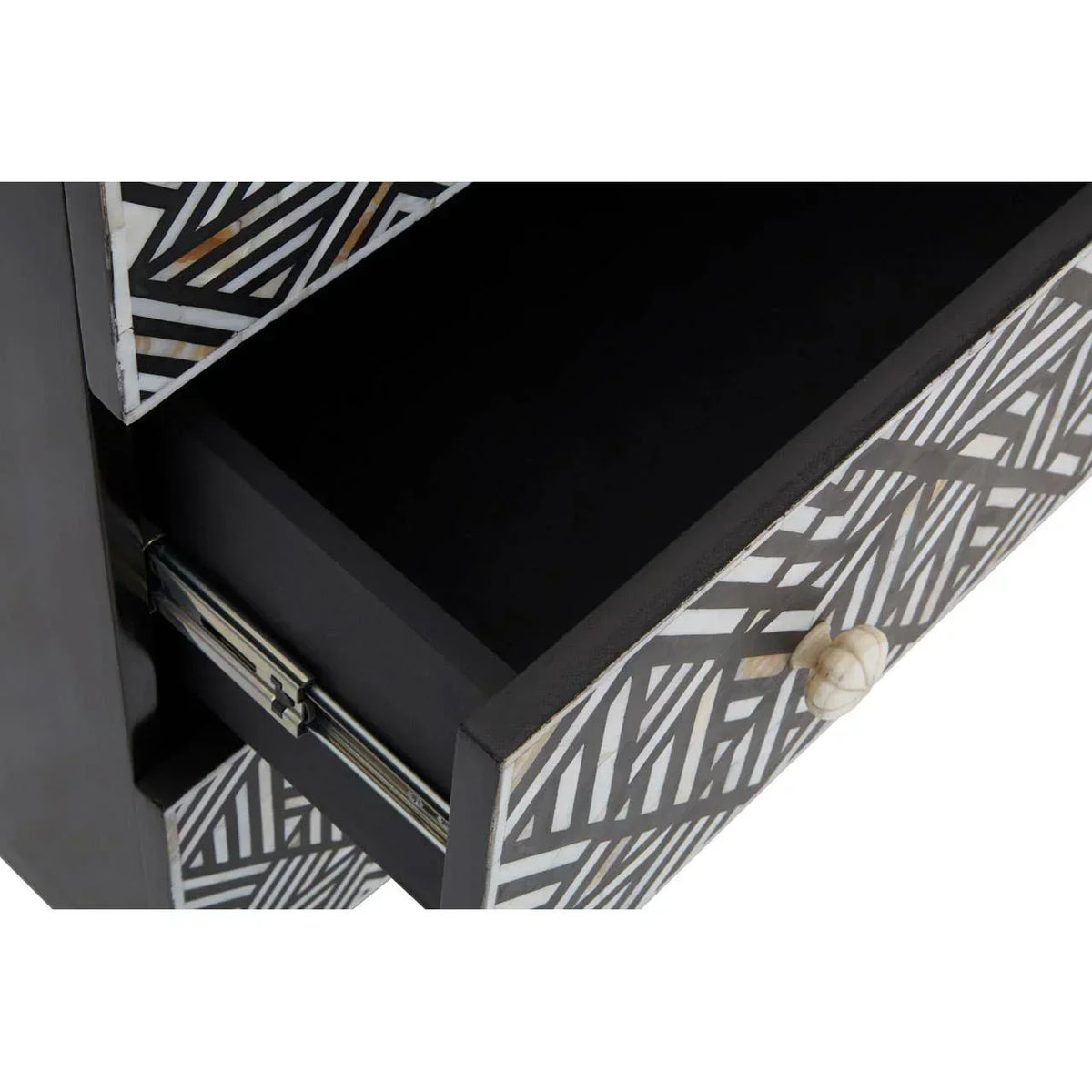 Geometric pattern black and white drawer unit with open drawer and round handle