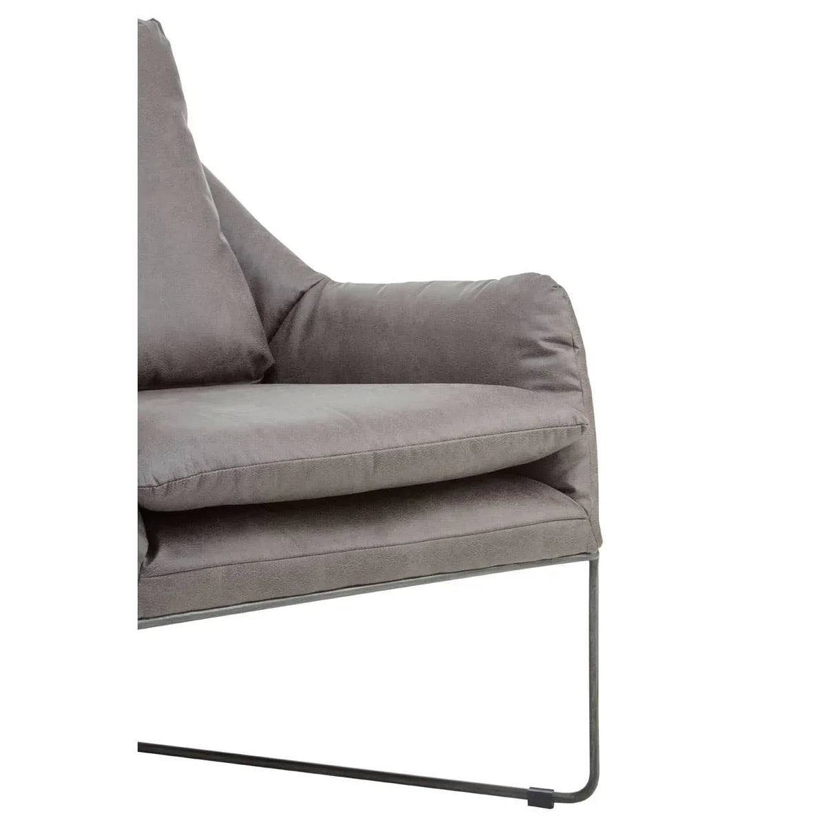Grey velvet armchair with metal frame and plush cushions, close side view