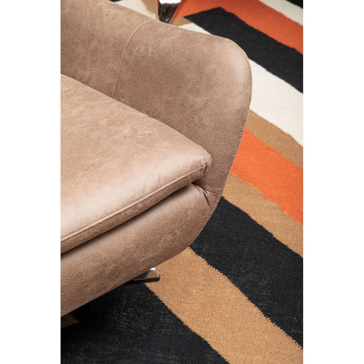 Light brown sofa corner with chrome leg on striped orange, black and tan rug