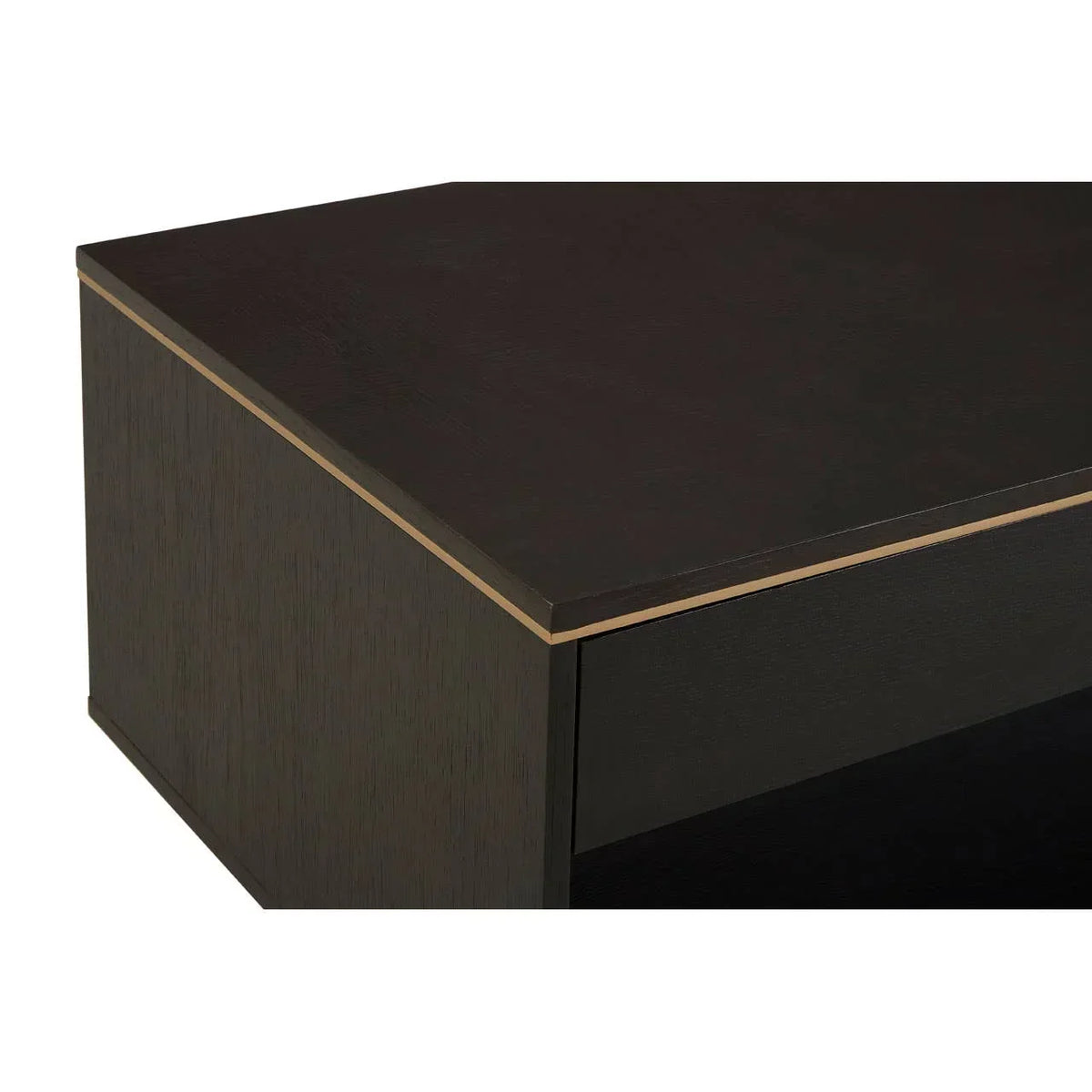 Close-up of dark wood coffee table corner with gold trim detailing