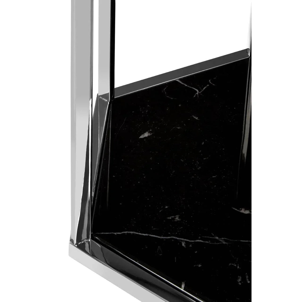 Close-up of black marble table top with chrome metal frame