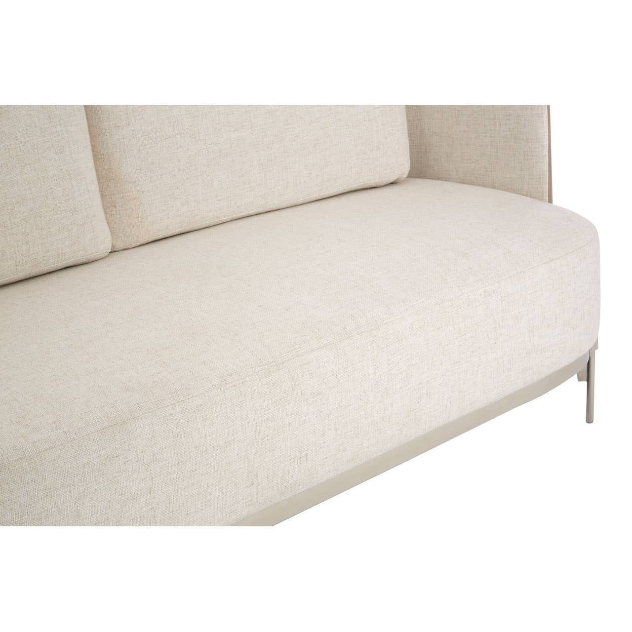 Ivory and mink two-seater sofa featuring a smooth, textured fabric upholstery with a minimalist design and sleek metal legs. The sofa has a low backrest and a spacious seat, ideal for modern living spaces