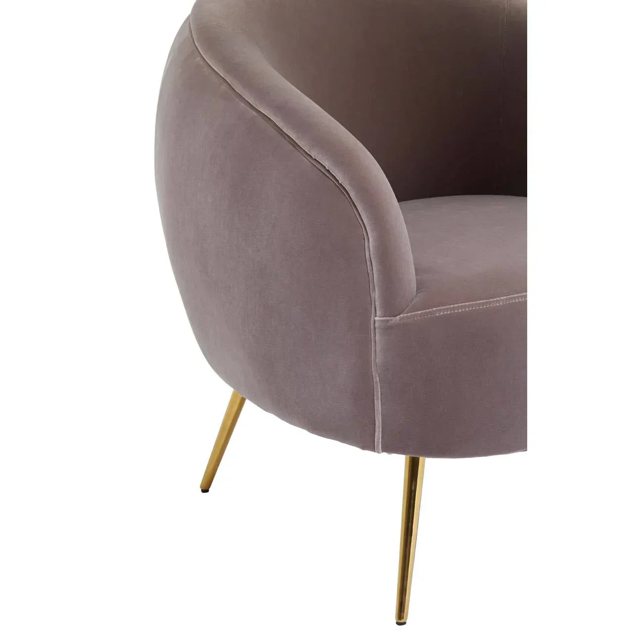 Closeup of grey velvet accent chair with curved back and gold metal legs