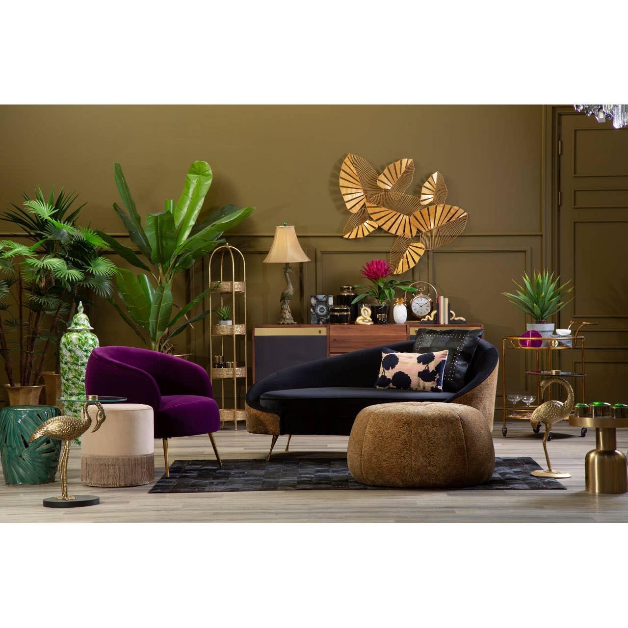 Velvet accent chair and sofa set with gold legs in modern living room with plants and decor