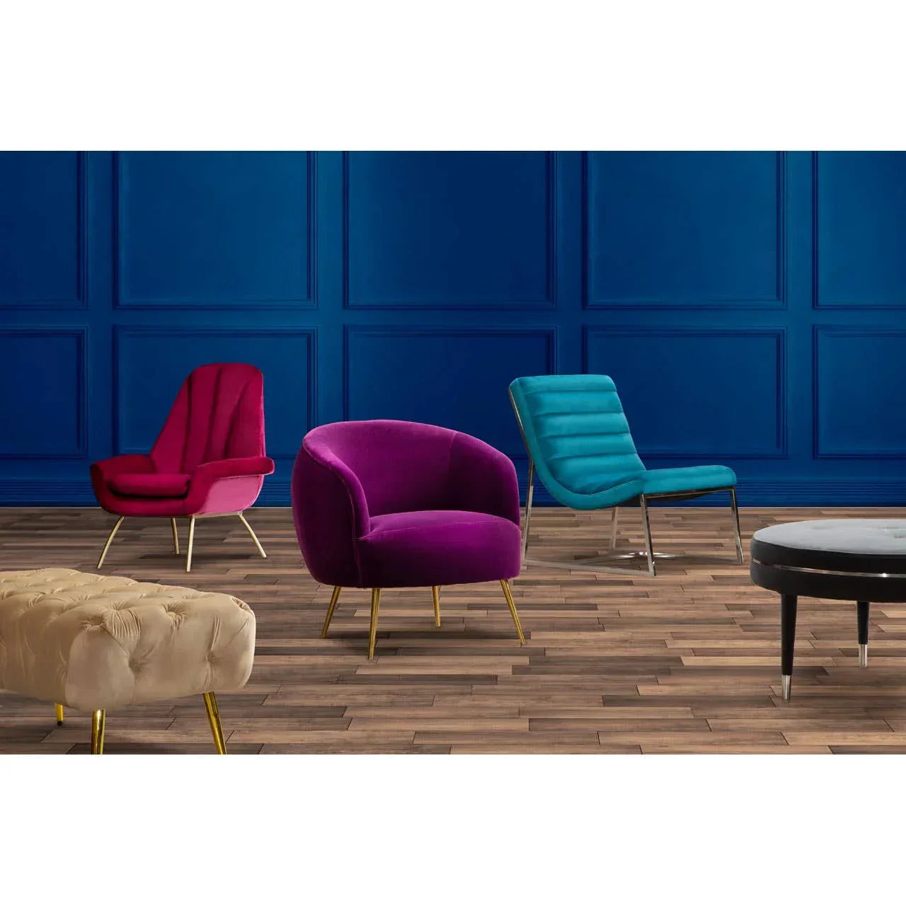Velvet accent chairs in purple, red, and teal with gold legs and ottomans on wood floor