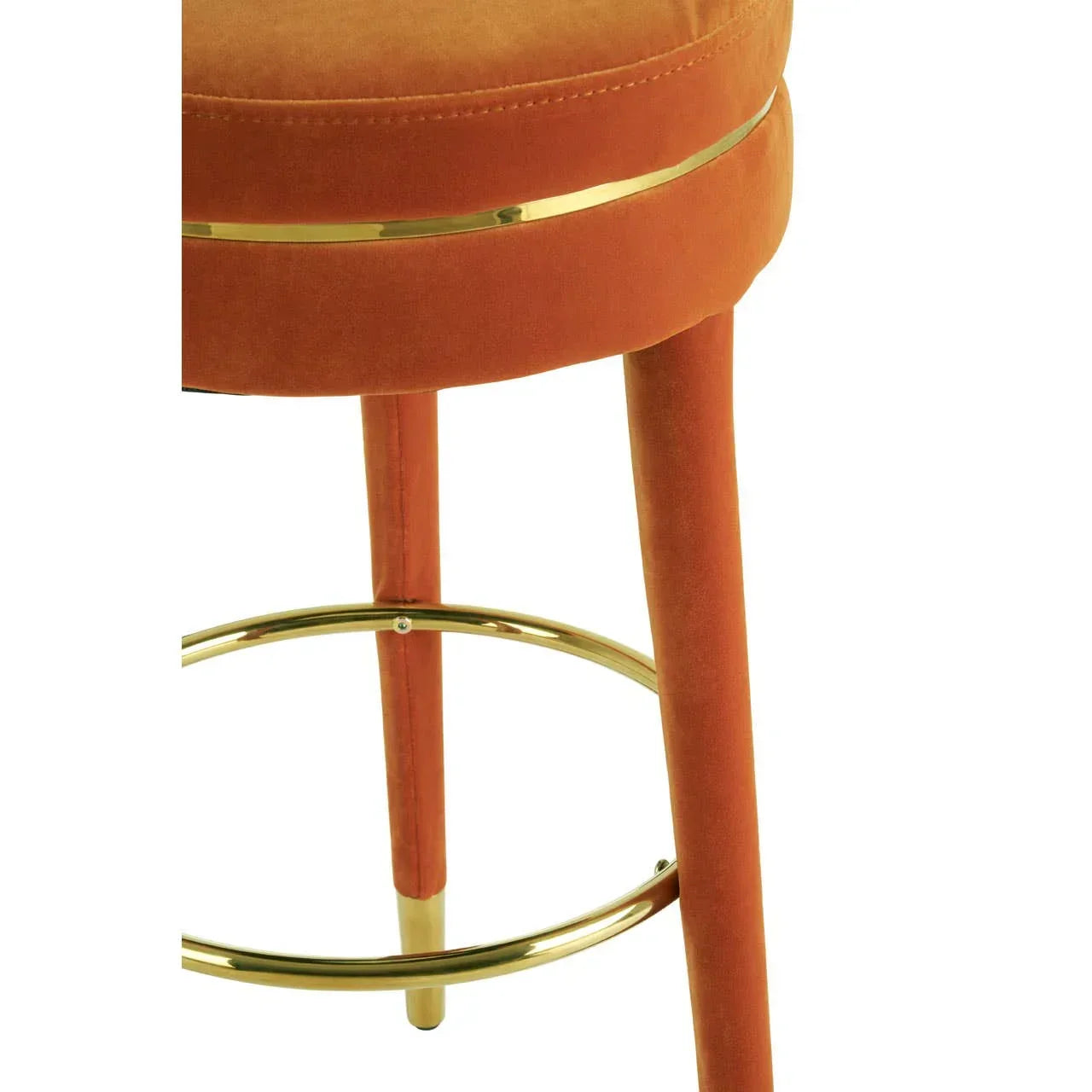 Velvet bar stool with orange upholstery and gold-finished metal footrest
