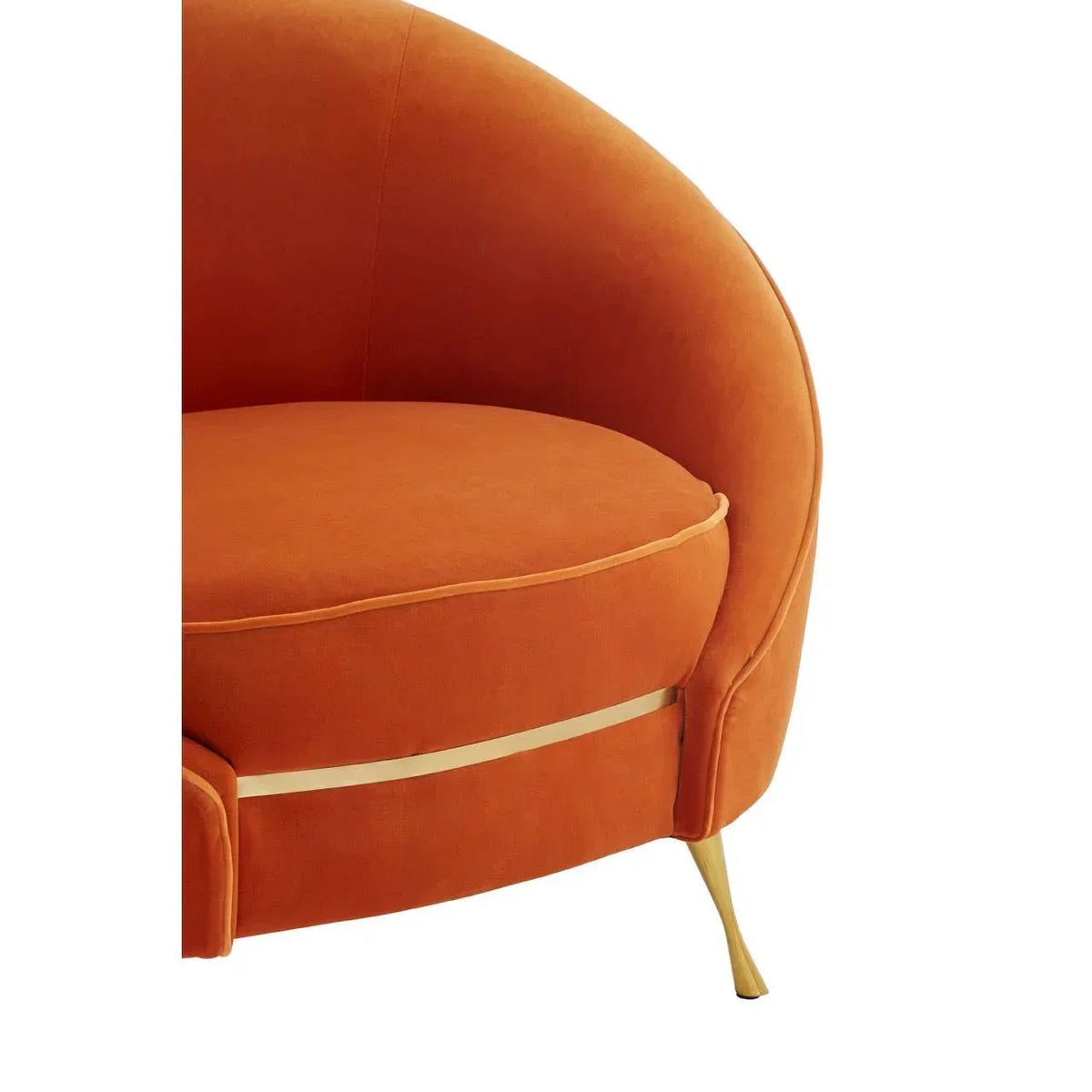 Orange velvet accent chair with gold legs and curved backrest, close-up view