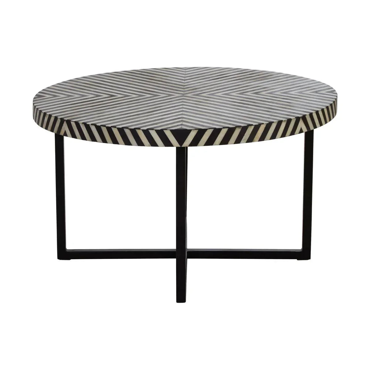Round coffee table with black and white geometric patterned top and black metal legs