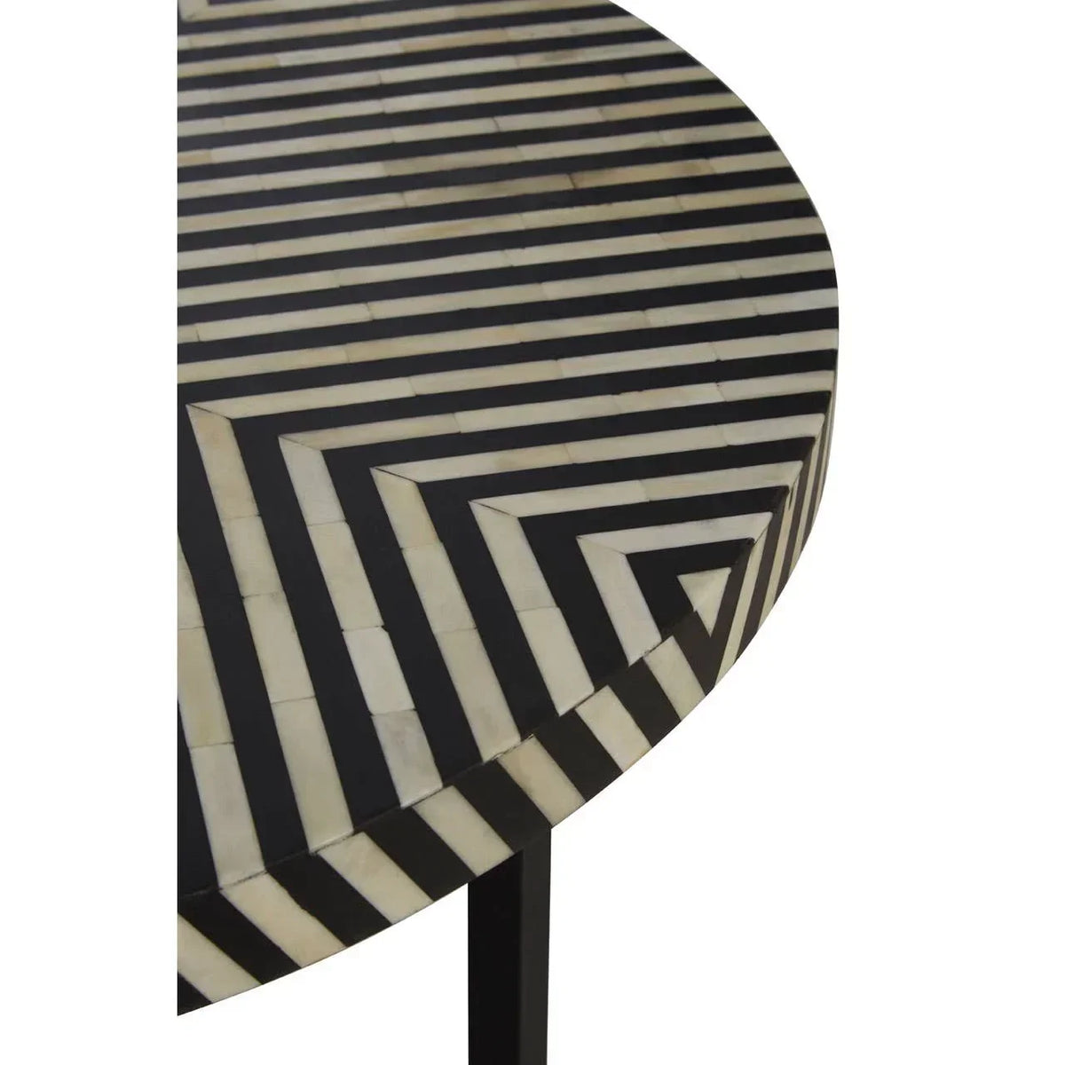 Round side table with black and white geometric striped inlay pattern, close up view