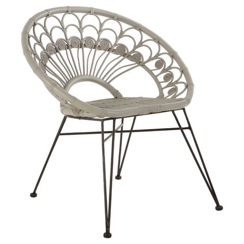 A grey natural rattan chair with a curved backrest featuring a fan-like design, supported by slender black metal legs. The seat is cushioned for comfort, and the overall style is modern and airy, suitable for indoor or outdoor use