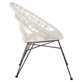 A white natural rattan chair with a unique woven design and a sturdy black metal frame, showcasing a modern and airy aesthetic. The chair features a contoured backrest and a comfortable seat, ideal for indoor or outdoor use
