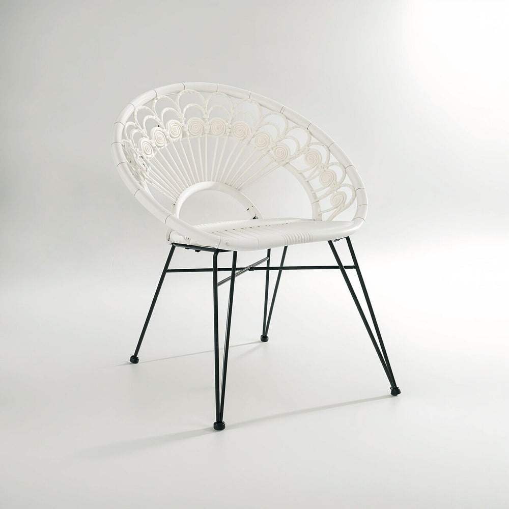 A stylish white rattan chair with a curved backrest and a natural woven texture, supported by sleek black metal legs, set against a light gray background