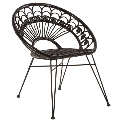 A black natural rattan chair with a curved backrest featuring a fan-like design, supported by slender metal legs. The seat is round and open, showcasing the intricate weaving of the rattan material