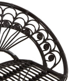 Black natural rattan chair featuring a curved backrest with intricate scrollwork and a slatted seat design, showcasing a blend of elegance and comfort
