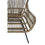 Natural rattan chair featuring a curved backrest and open weave design, supported by sleek black metal legs. The chair showcases a warm, earthy tone, highlighting the texture of the rattan material