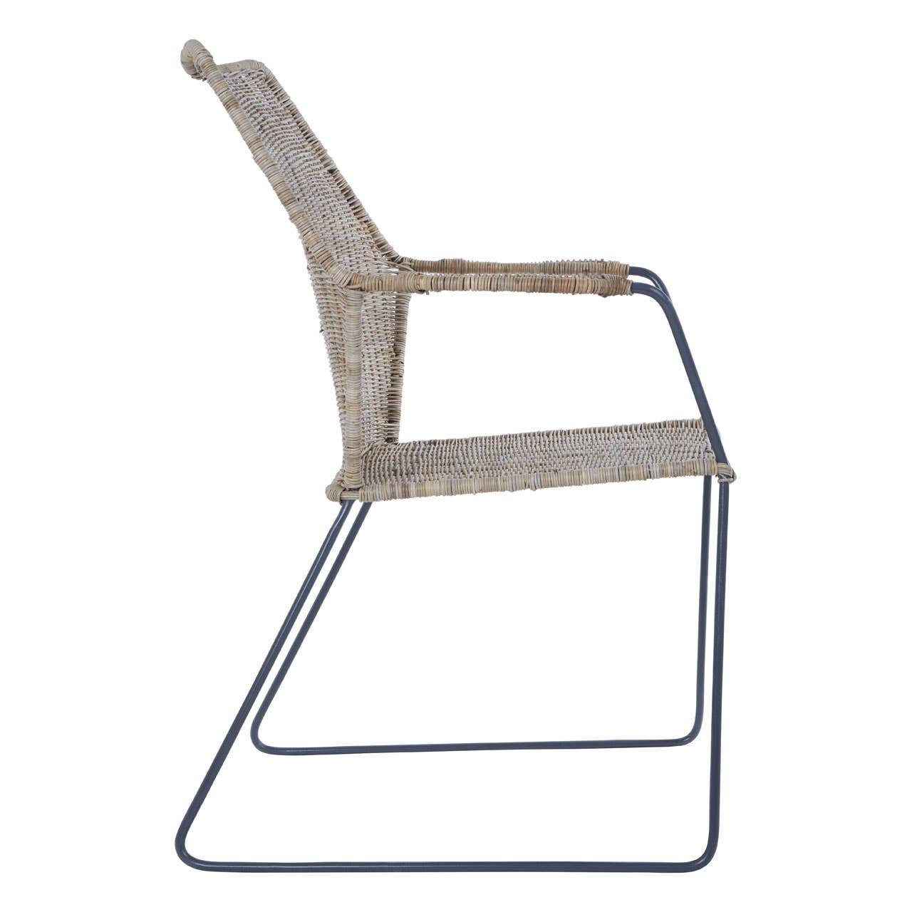 Natural rattan chair with an angled design, featuring a light beige woven seat and backrest, supported by a sleek metal frame with a minimalist style. The chair has a modern aesthetic suitable for various home decor settings