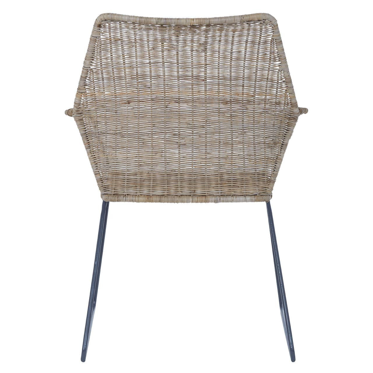 Natural rattan chair with an angled design, featuring a hexagonal backrest and slender metal legs. The chair showcases a woven texture in light brown tones, emphasizing a modern and minimalist aesthetic