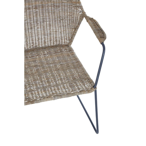 Natural rattan chair with an angled design, featuring a woven seat and backrest, supported by a sleek metal frame with a modern aesthetic. The chair has a minimalist look, showcasing a combination of natural textures and contemporary lines