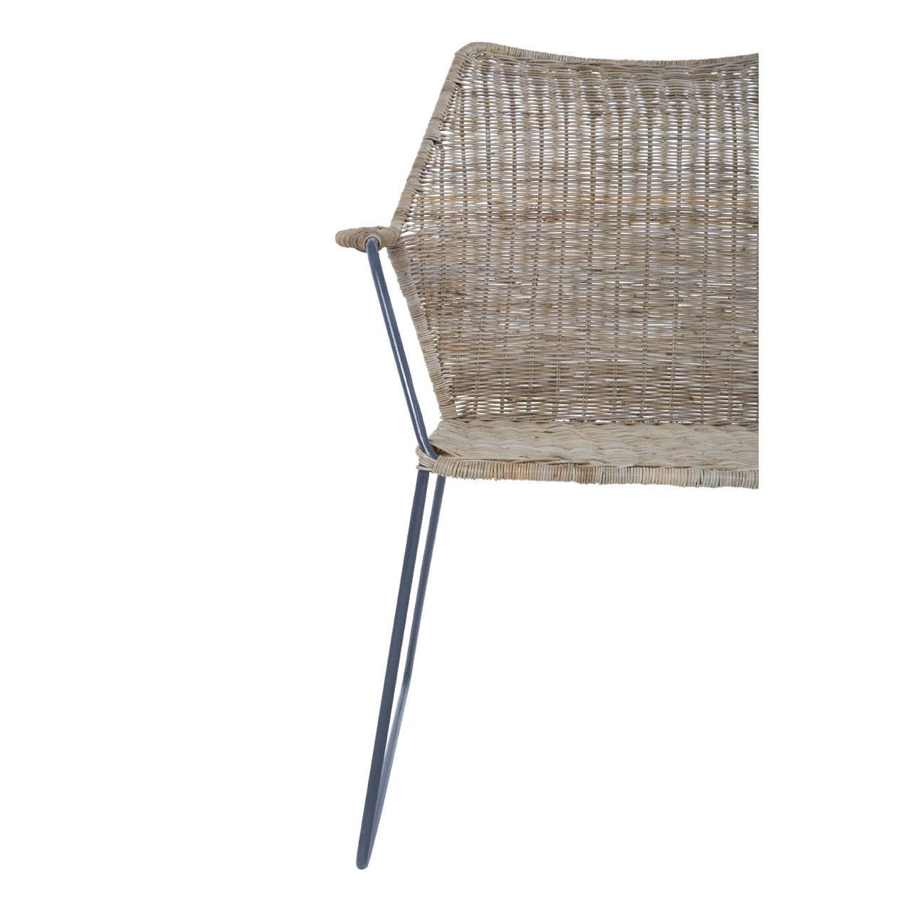 Natural rattan chair with an angled design, featuring a woven seat and backrest in a light brown color, supported by sleek metal legs. The chair's modern aesthetic combines organic materials with a contemporary silhouette