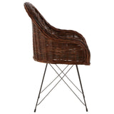Natural croco rattan chair featuring a curved backrest and a woven texture, supported by slender metal legs in a geometric design. The chair showcases a rich brown color, highlighting the organic look of the rattan material
