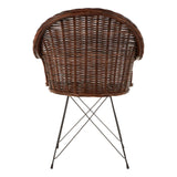 Natural croco rattan chair with a rounded backrest and a woven design, supported by slender metal legs in a crisscross pattern, showcasing a warm brown color