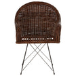 Natural croco rattan chair featuring a rounded backrest and a woven design, supported by sleek metal legs in a geometric arrangement. The chair showcases a rich brown color, highlighting the texture of the rattan material
