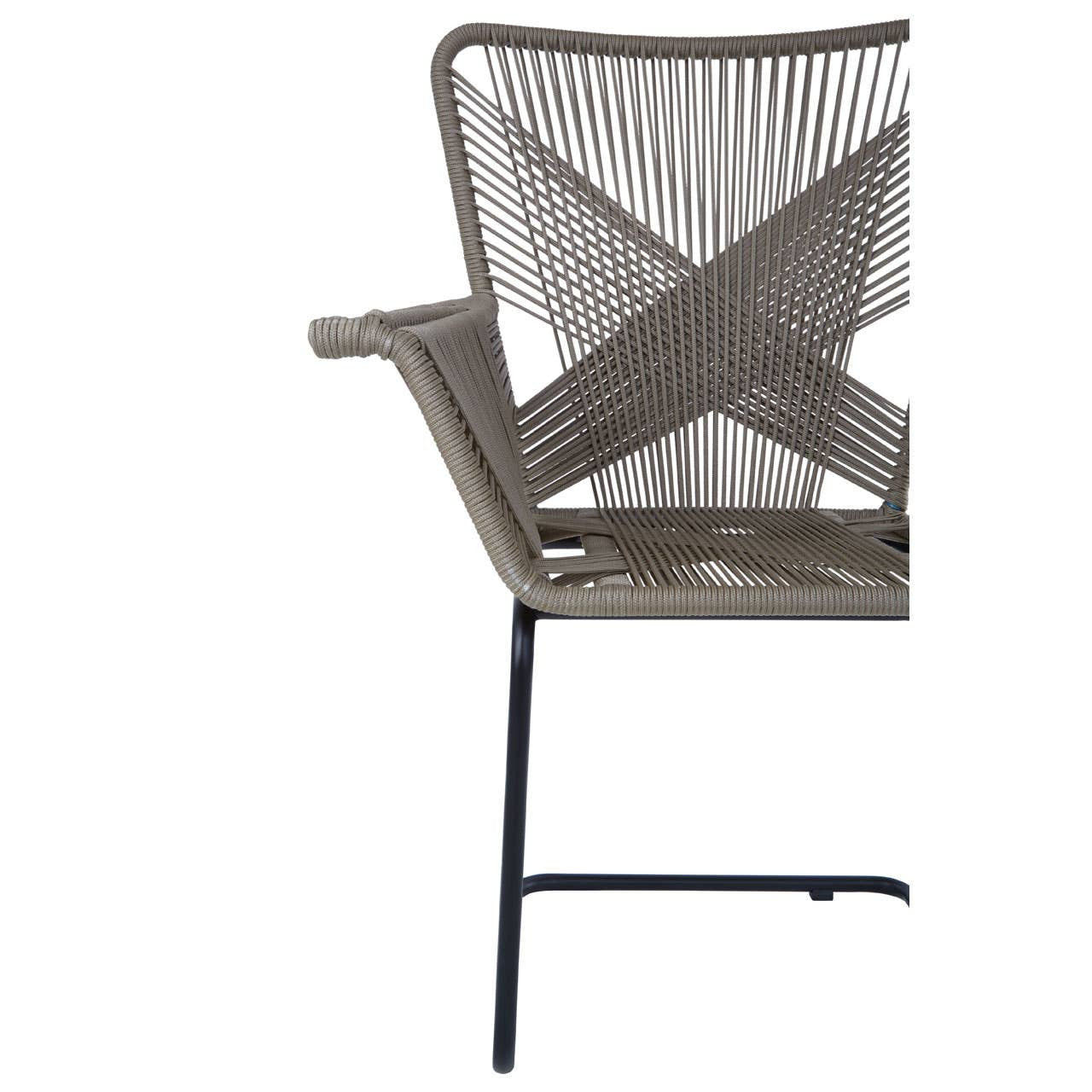 A side view of the Manado Rattan Effect Chair featuring a modern design with a woven rattan effect backrest in a neutral color, supported by a sleek black metal frame and legs. The chair has a minimalist aesthetic, suitable for both indoor and outdoor settings