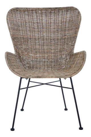 Curved backrest and armrests of a natural rattan chair with a woven texture, supported by a black metal frame and legs, showcasing a modern and stylish design suitable for home decor