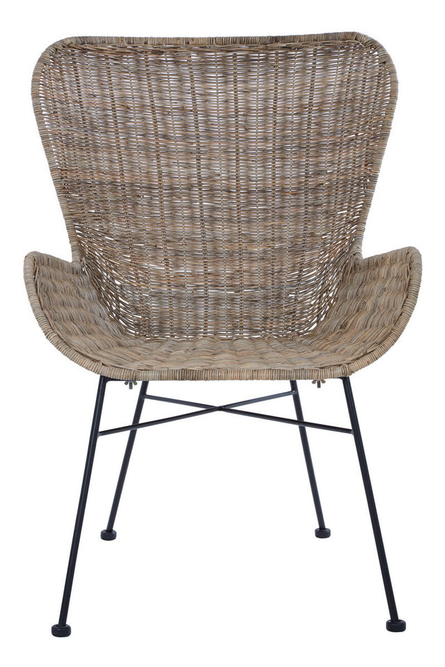 Curved backrest and armrests of a natural rattan chair with a woven texture, supported by a black metal frame and legs, showcasing a modern and stylish design suitable for home decor