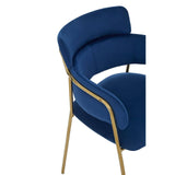 Blue velvet dining chair with gold metal legs and curved backrest, side angle view