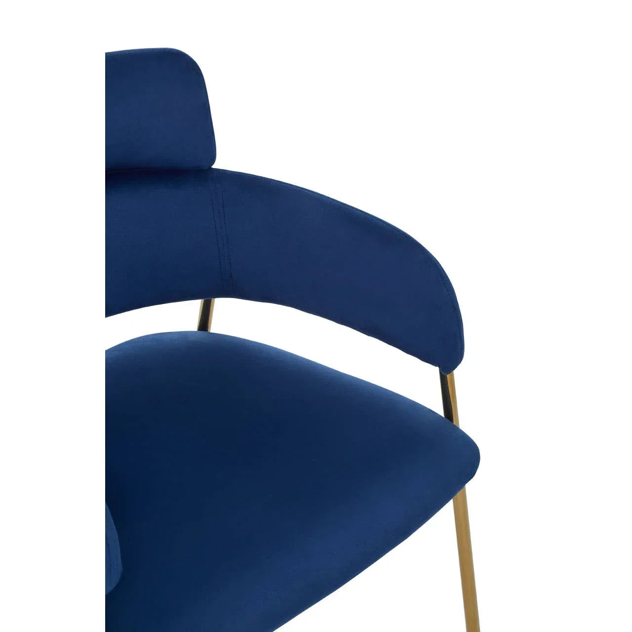 Close-up of blue velvet accent chair with gold metal legs and curved armrest