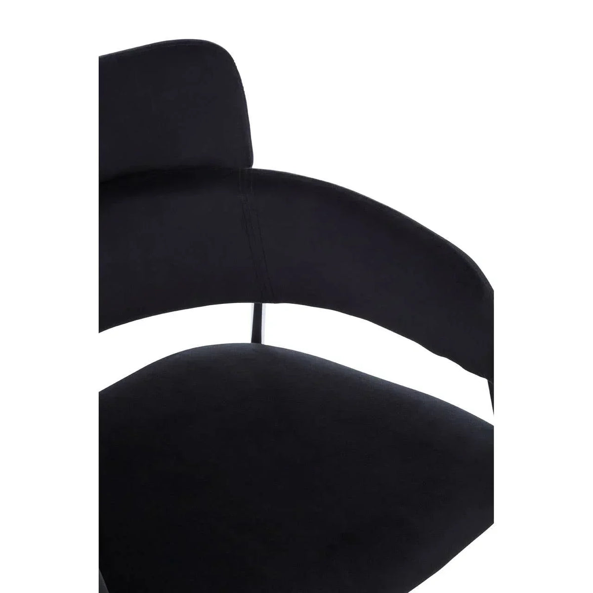 Close-up of black velvet dining chair seat and curved backrest