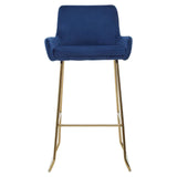 Blue velvet bar stool with gold metal legs and low backrest, front view