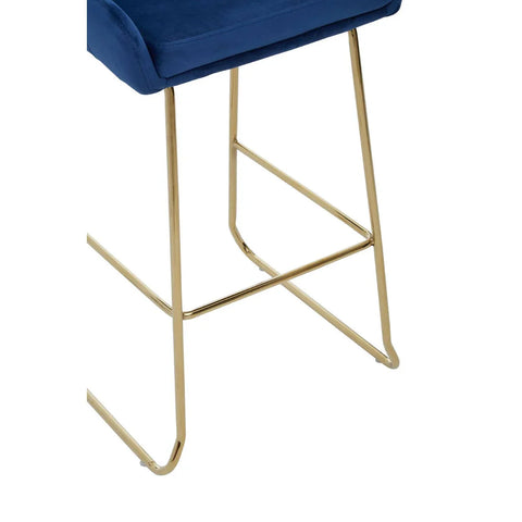 Blue velvet bar stool seat with gold metal legs, close-up of base and structure