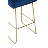 Blue velvet bar stool seat with gold metal legs, close-up of base and structure