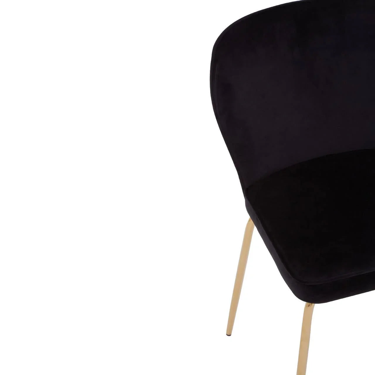 Black velvet dining chair with curved backrest and slim gold legs, angled side view