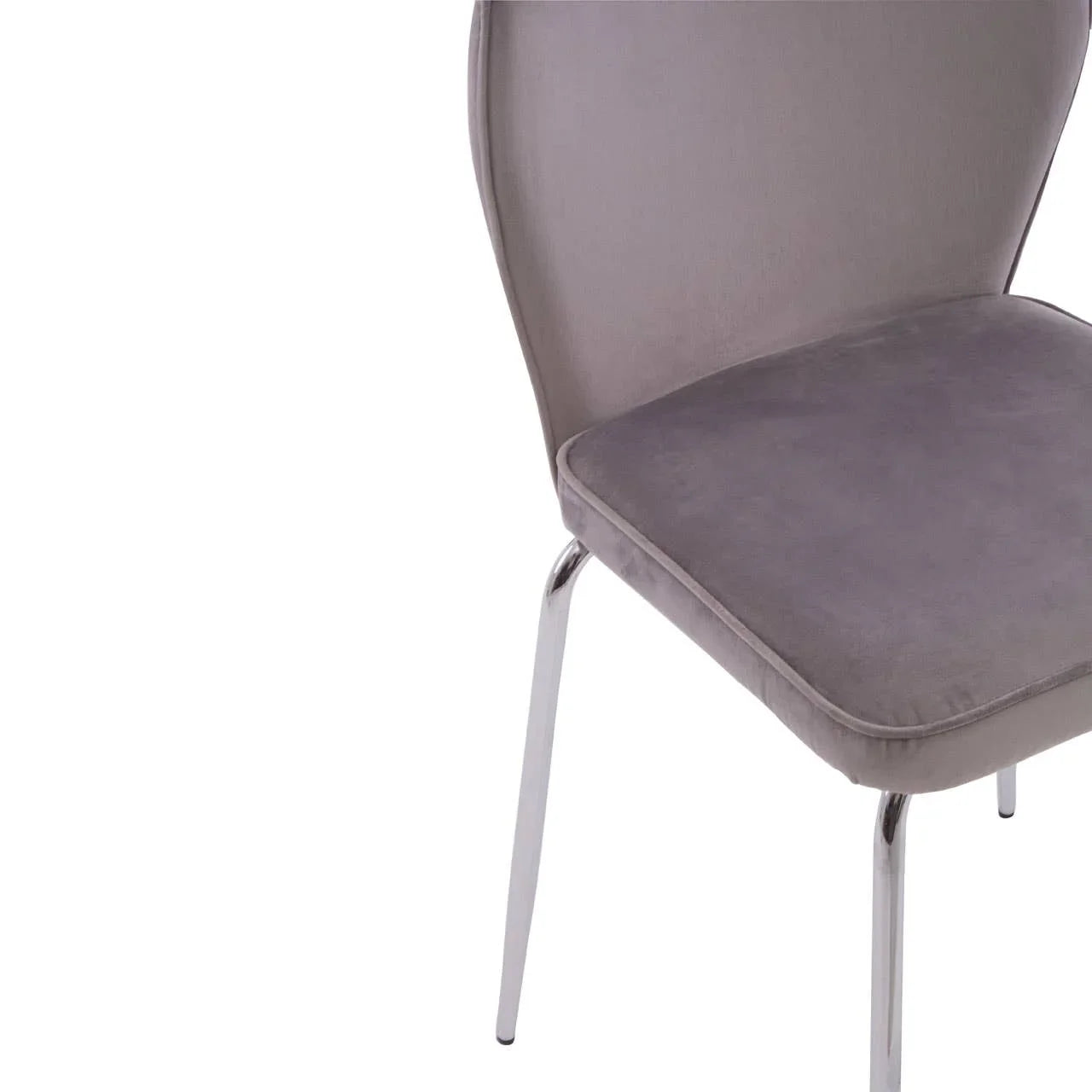 Grey velvet dining chair with chrome legs, close-up of seat and backrest